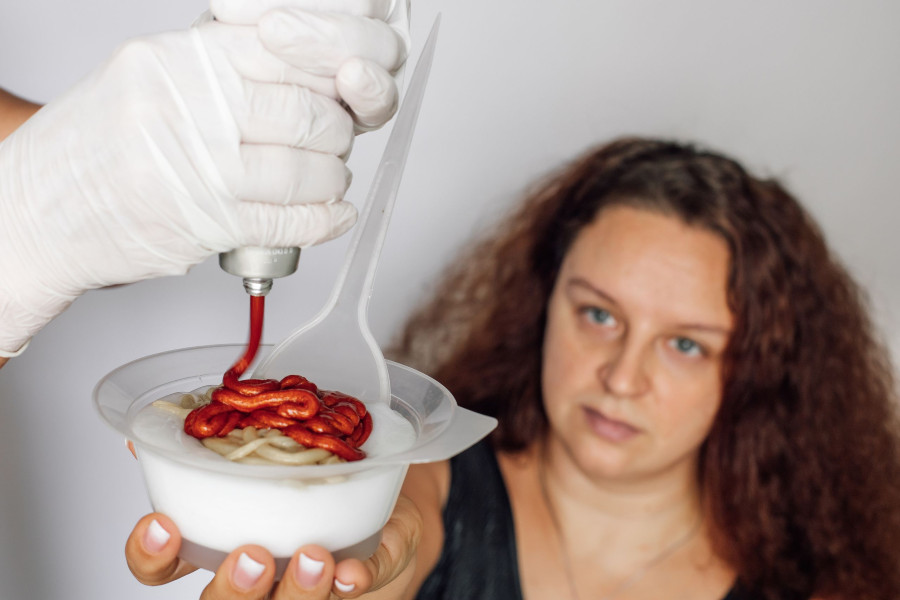 Young Woman With Long Dark Red Lush Hair Holding Hair Dye Bowl In Hand And Looking At Gloved Hands S